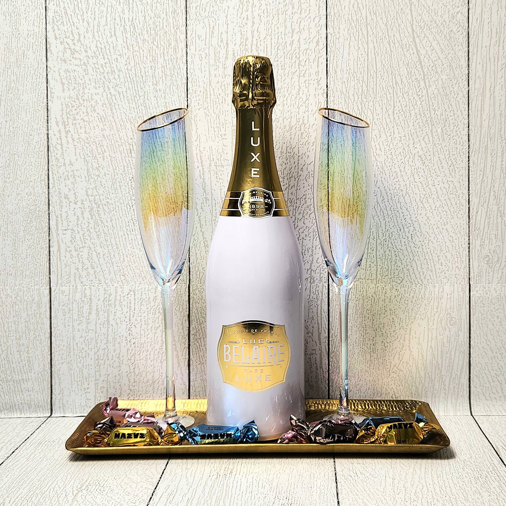 A Golden Toast champagne gift set with bubbly, gold-rimmed flutes and truffles